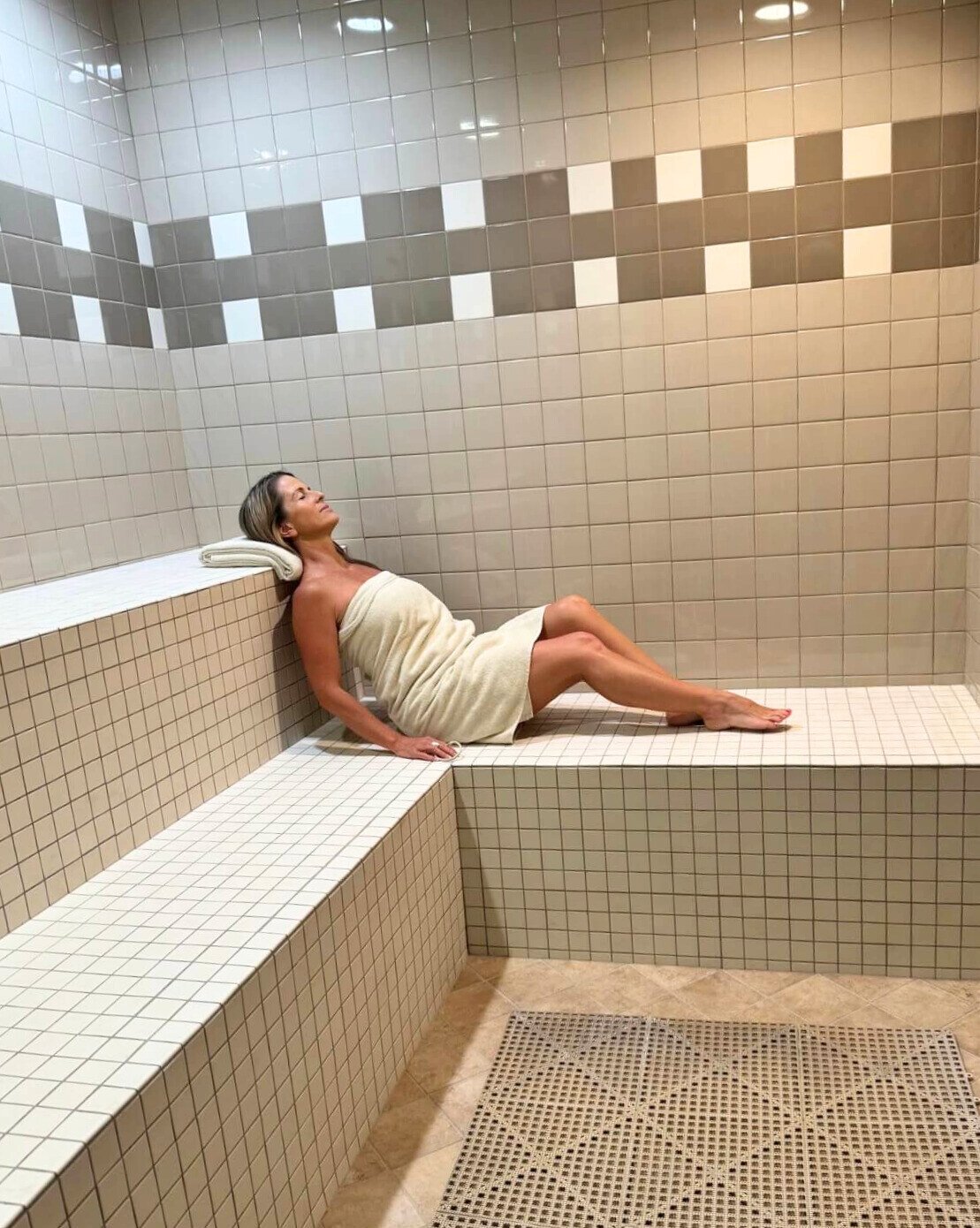 woman relaxing in steam room